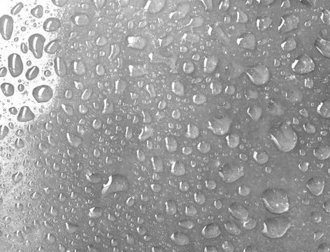 Water drops close-up as a background. Stock Photos