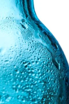 Water drops on cold bottle Stock Photos