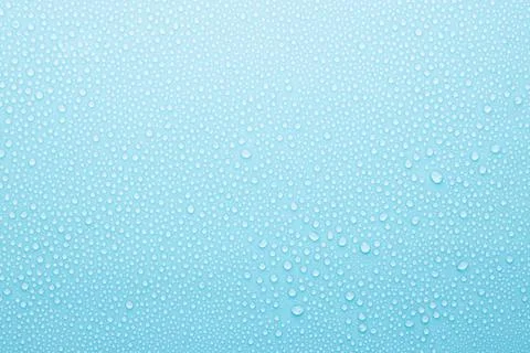 Water drops on cold soft light blue background as pattern of tiny glossy shin Stock Photos