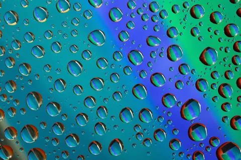 Water drops on colored background Stock Photos