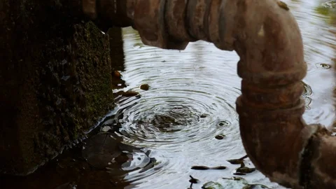 Water drops from the cracks of the pipe Stock Footage 104327241