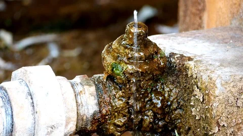 Water drops from the cracks of the pipe4 Stock Footage 104328046