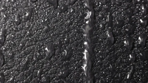 Water drops on a dark leather surface. Video stock 37016009