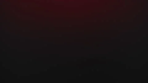 The water drops down on red light background and change  water wave blue light Stock Footage 146112547