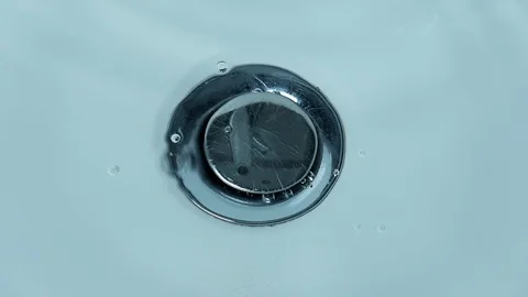 Water drops drip falling into the water of white, clean sink - 1 Stock Footage 101235443