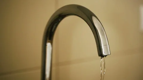 Water drops drip from a pipe Stock Footage 87458441