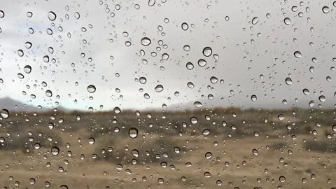 Water drops dripping on the car window Stock Footage 336435121