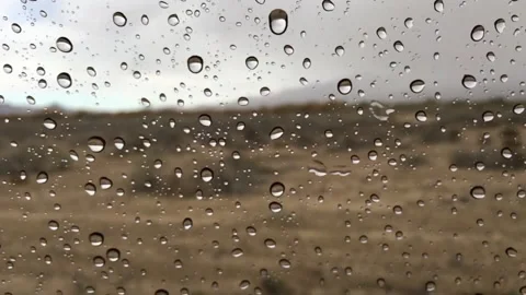 Water drops dripping on the car window Stock Footage 336437614