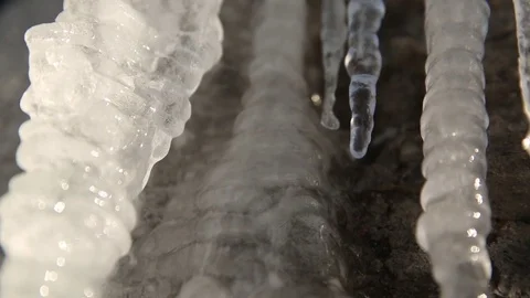 Water drops dripping from icicles Stock Footage 83866800