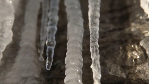 Water drops dripping from icicles Stock Footage 83866812