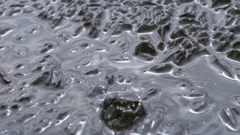 Water drops dropping over melting ice Stock Footage 98002858