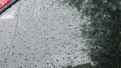 Water drops during rain roll down the side window of a car.	 Stock-Footage 313906200