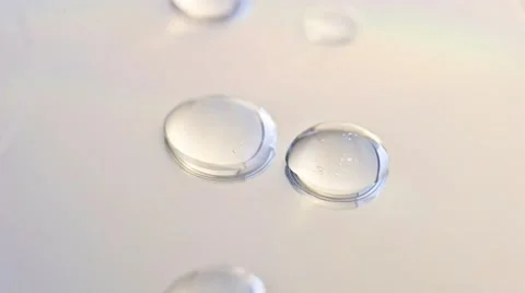 Water drops evaporating on a clean surface Stock Footage 56568173