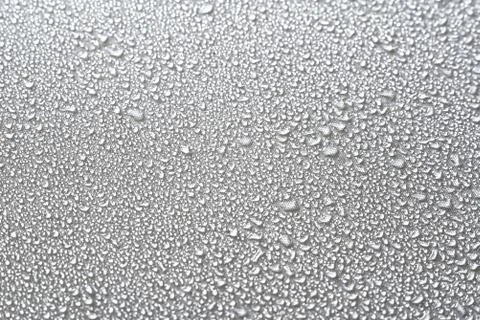 Water drops on the fabric substrate macro Stock Photos