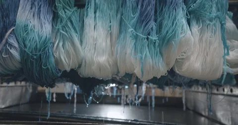 Water drops fall from hemp fabric in a factory in slow motion Stock Footage 91474500
