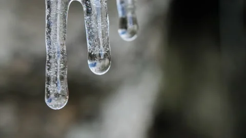 Water drops fall from ice floe, Sierra de Guadarrama National Park, Spain. Stock Footage 170857175