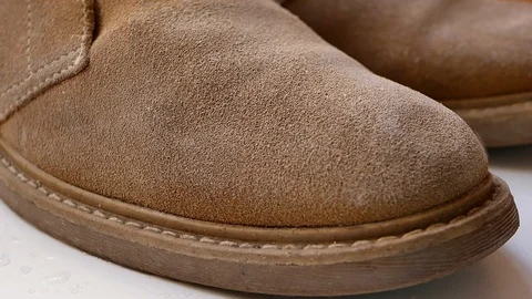 Water drops fall on waterproof suede leather desert boots Stockbeeldmateriaal 119195255