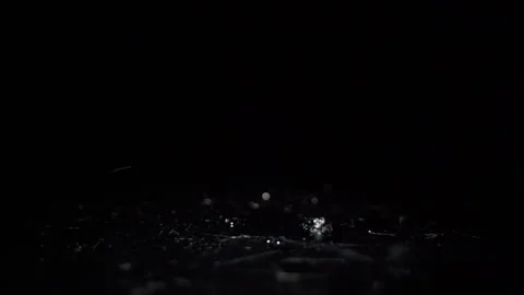 Water drops falling in black low light in slow motion close-up Stock Footage 160403868
