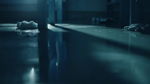 Water drops falling on a dark prison floor Stock Footage 331601769