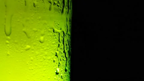 Water drops falling down on the glass of beer. Stock Footage 155493636
