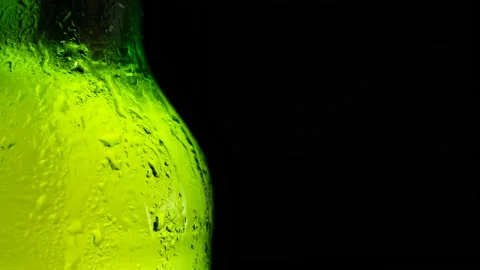 Water drops falling down on the glass of beer. Stock Footage 156171791