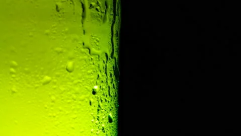Water drops falling down on the glass of beer. Stock Footage 162314587