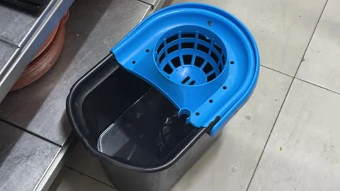 Water drops falling into a mop bucket Видео 344100290