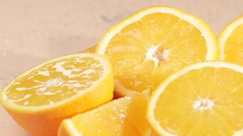 Water drops falling on orange slices, slow motion. Healthy food background Video stock 297744842