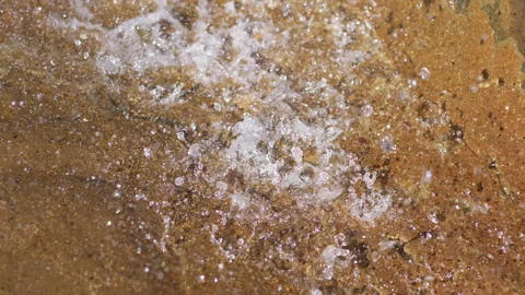 Water drops falling from rock in 4k slow motion 60fps Video stock 119646977