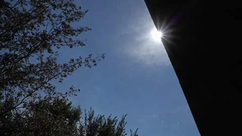 Water drops falling from the side of a rooftop during the sunshine Stock Footage 336435580
