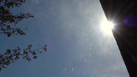 Water drops falling from the side of a rooftop during the sunshine Stock Footage 336438700