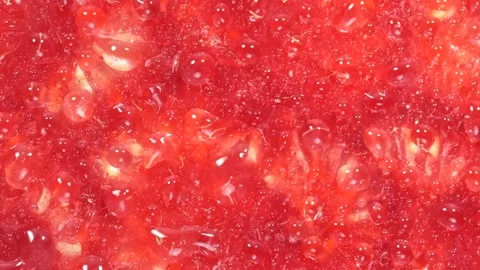 Water drops falling on the squeeze raspberries background. Stock Footage 308931131