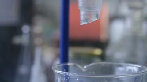 Water drops in flask Stock Footage 21783260