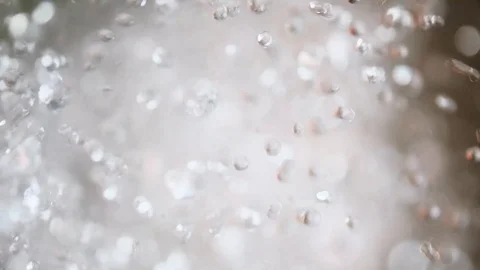 Water drops fly up on a blurred background Stock Footage 118762862