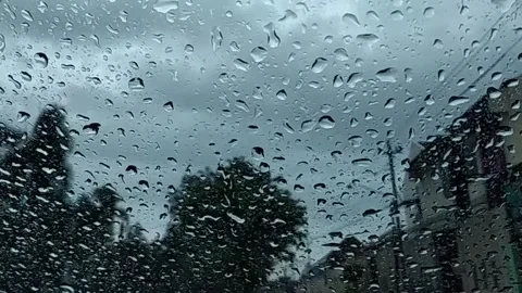 Water Drops following down on clear glass Stock Footage 149334050