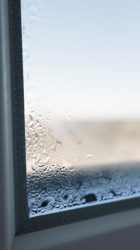 Water Drops Form on a Steamy Window from Condensation in the Morning Stock Footage 328277529