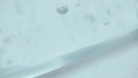 Water drops on a glass Stock Footage 303630087