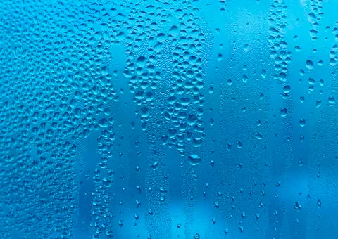 Water drops on glass Stock Photos