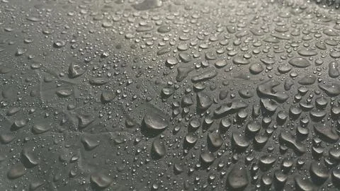 Water drops on a gray background Stock Photos
