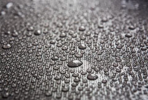Water drops on gray background Stock Photos