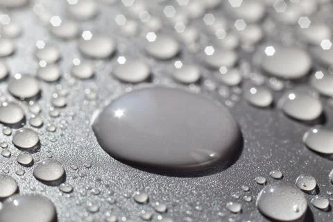 Water drops on gray background Stock Photos