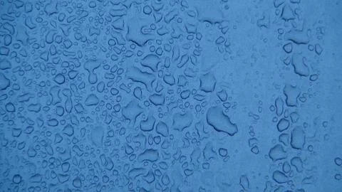 Water drops on gray plastic close up photo Stock Photos