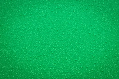 Water Drops On Green Background. Stock Photos
