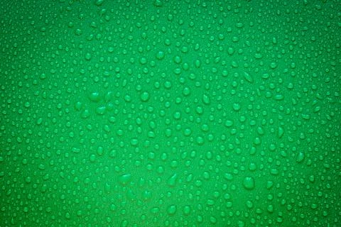 Water Drops On Green Background. Stock Photos