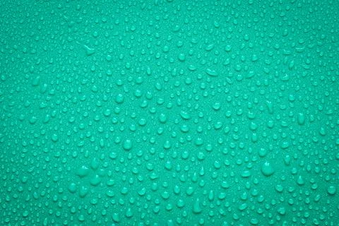 Water Drops On Green Background. Stock Photos