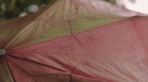 Water Drops on Iridescent Umbrella Stock Footage 63395320