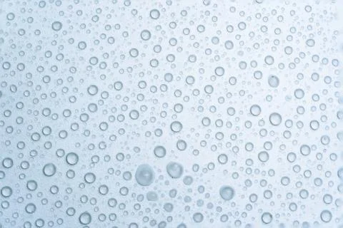 Water drops on a light blue background Stock Photos