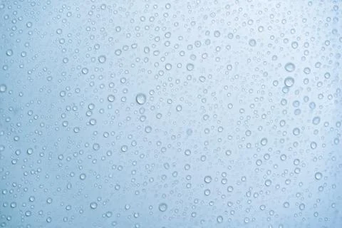 Water drops on a light blue background Stock Photos