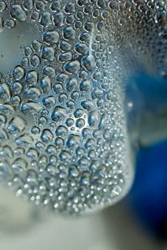 Water drops macro from a plastic bottle fifty megapixels Stock Photos