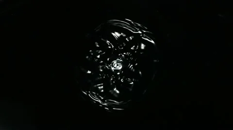 Water drops making ripple, Slow Motion Stock Footage 12350225